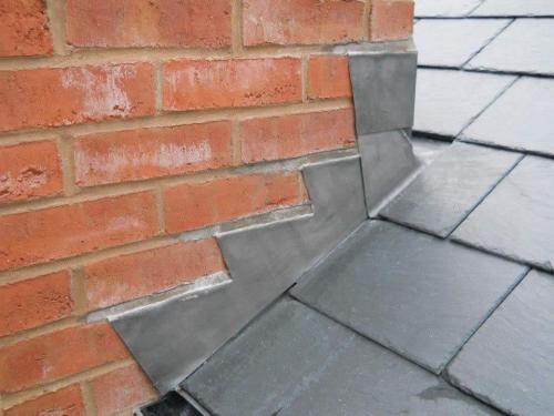 An example of some slating and brick work. The materials are shiny/bright and look brand new.