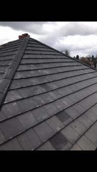 A new roof of grey slates. taken from roof level.
