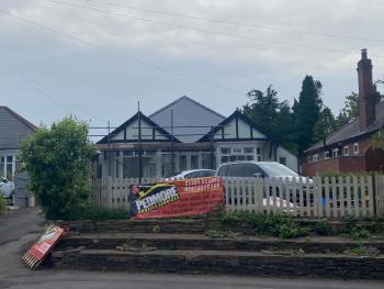 Pedmore Roofing Services new banner in front of new roof