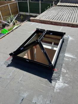 Before of a skylight installation on a firestone flat roof